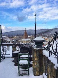 Snow covered built structure against sky