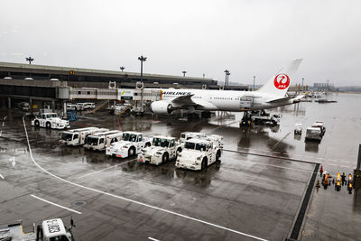 High angle view of people at airport against sky