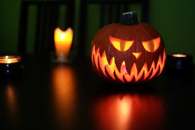 Close-up of illuminated pumpkin against blurred background
