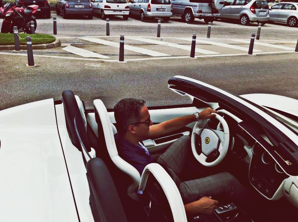 transportation, land vehicle, mode of transport, car, street, road, bicycle, travel, stationary, motorcycle, parking, parked, incidental people, city, city life, men, city street, day