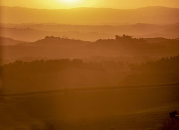 Scenic view of silhouette landscape against sky during sunset