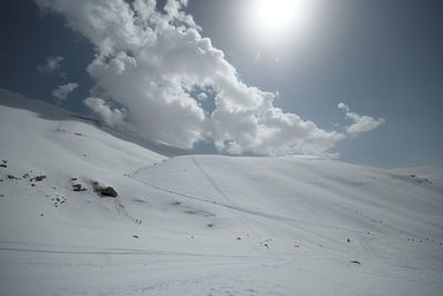 Scenic view of landscape against sky during winter