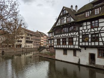 Traditional half-timbered buildings by the river ill in strasbourg, france.