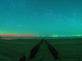 Scenic view of sea against sky at night