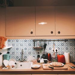 Bottles on table in kitchen