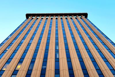 Low angle view of skyscraper against clear sky