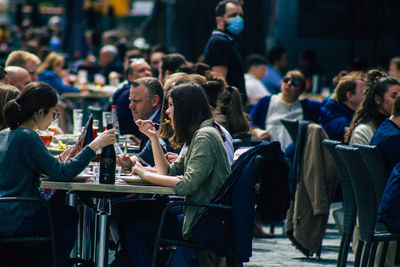 Group of people sitting on table