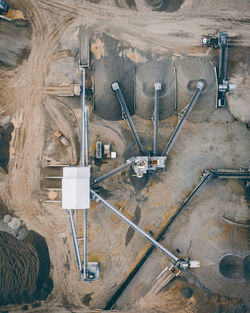 High angle view of telephone pole against wall