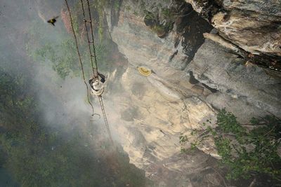 High angle view of rope on rock