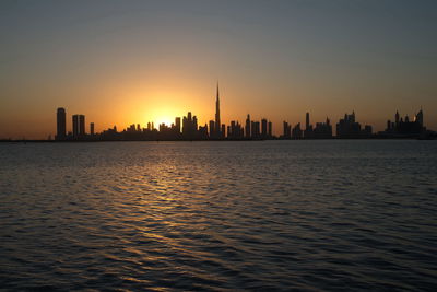 Dubai slyline from dubai creek harbour and dubai canal to downtown and business bay, uae