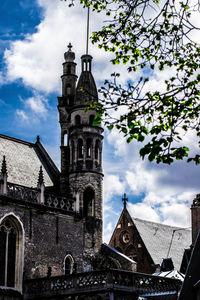 Low angle view of clock tower against sky