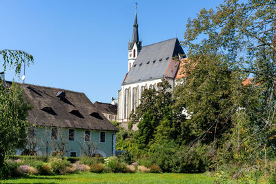 St. vitus church in cesky krumlov, czech republic seen from town park