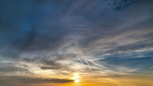 Low angle view of vapor trails in sky