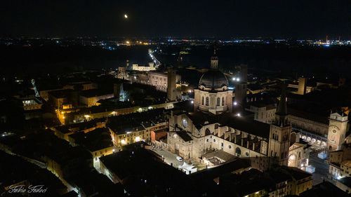 High angle view of illuminated buildings in city at night