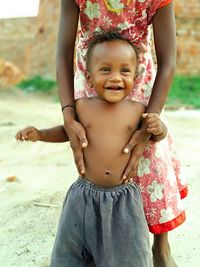 Girl standing with cute boy on road