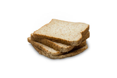 Close-up of bread on white background