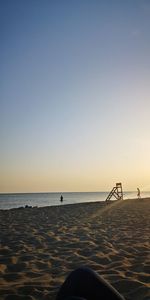 Scenic view of sea against clear sky during sunset