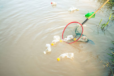 High angle view of toys floating on lake