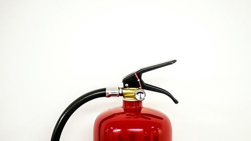 Fire extinguisher against white background