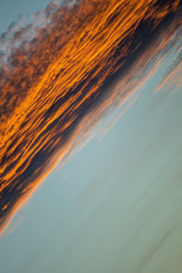 Aerial view of sea against sky during sunset