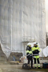 Engineers talking at building site