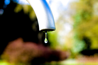 Close-up of water dripping from faucet