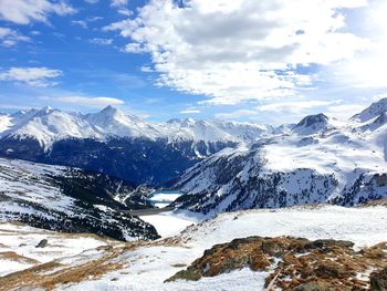 Scenic view of snowcapped mountains against sky