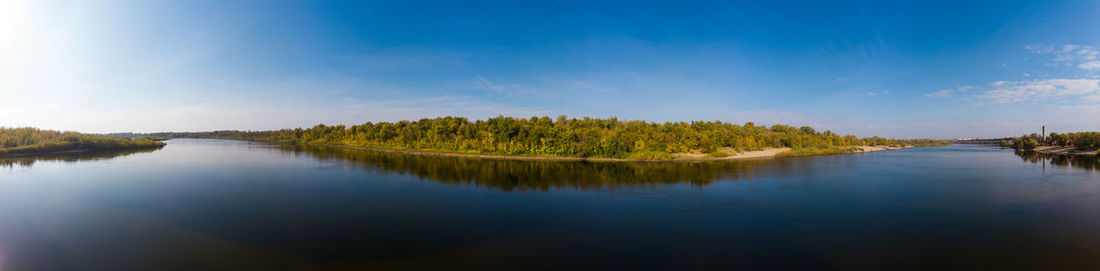 Scenic view of lake against blue sky