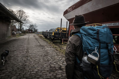 Rear view of man on street in city