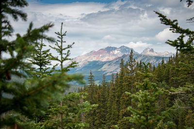 Scenic view of mountains against cloudy sky