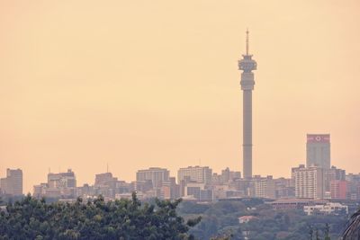 Urban skyline against clear sky