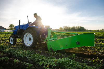 Tractor on field against sky