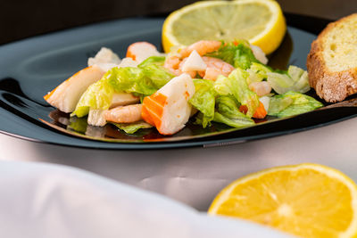 Close-up of salad served in plate on table