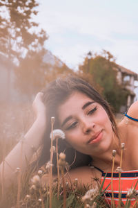 Portrait of young woman looking away