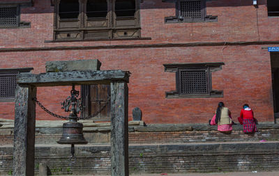 View of old building against brick wall