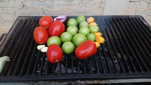 High angle view of fruits and vegetables on barbecue grill