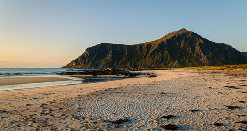 Scenic view of beach against clear sky