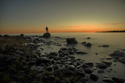 Scenic view of sea against sky during sunset