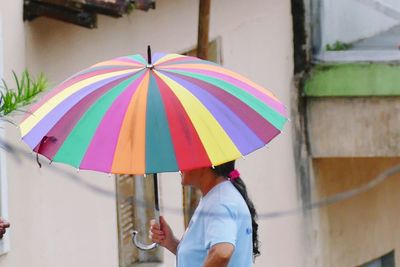 Colorful holding umbrella