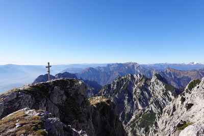 Scenic view of mountains against clear blue sky