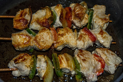 High angle view of meat on barbecue grill