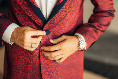 Midsection of man wearing blazer