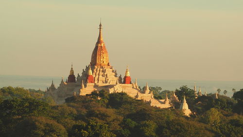 Ananda temple amidst trees against sky