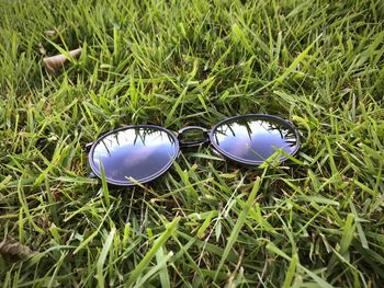 High angle view of eyeglasses on grass