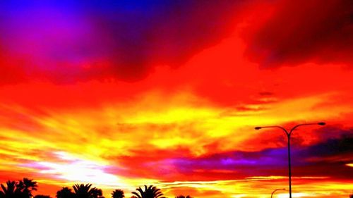 Low angle view of cloudy sky at sunset