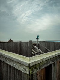 Pier over sea against sky