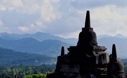 Temple against cloudy sky