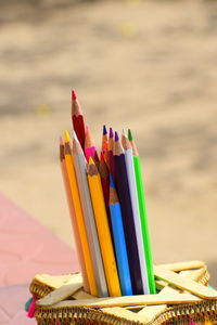 Close-up of multi colored pencils on table