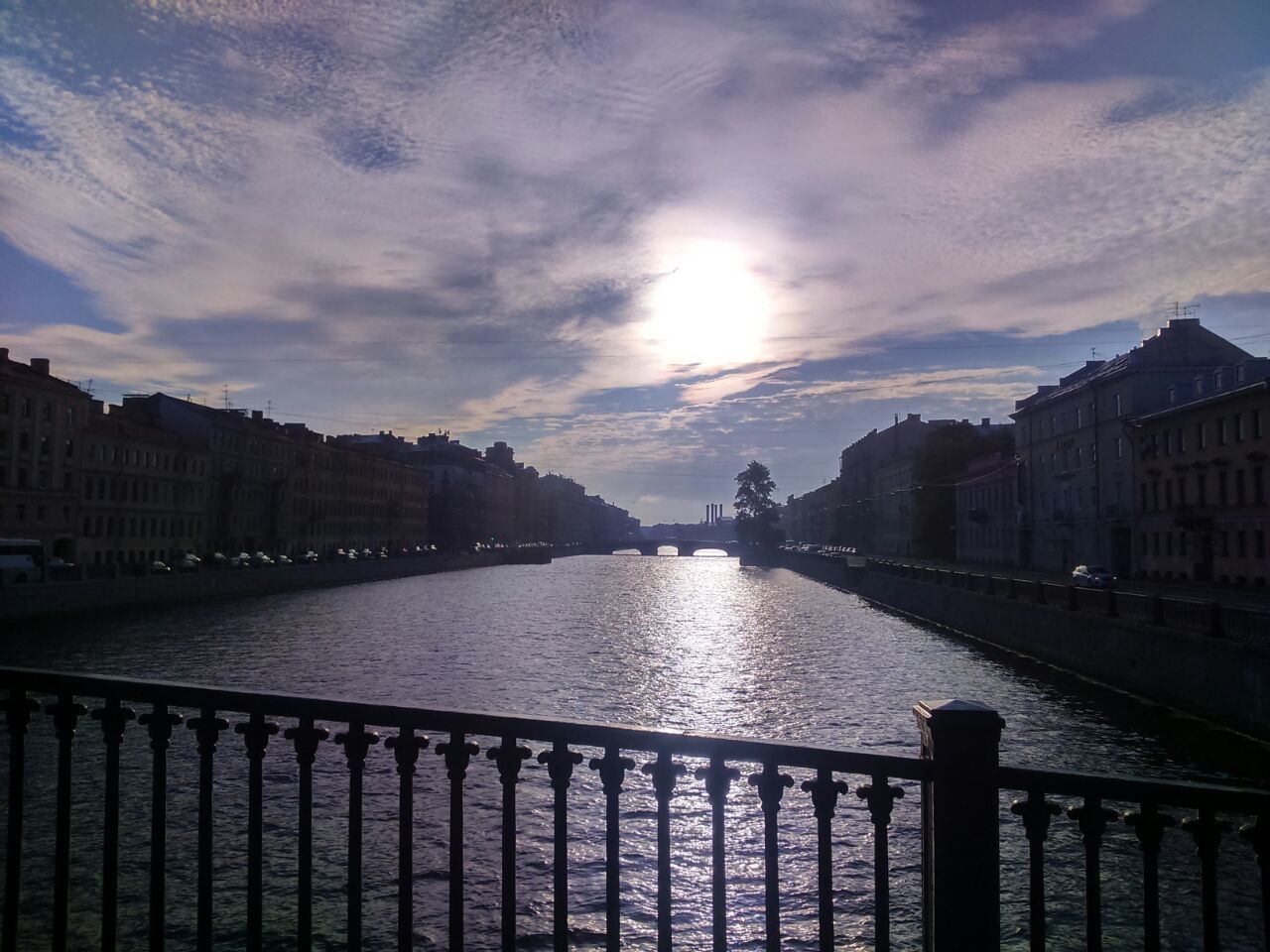 architecture, building exterior, built structure, sky, water, cloud - sky, railing, city, river, canal, sunset, cloud, residential structure, cloudy, residential building, building, reflection, sunlight, nature, outdoors