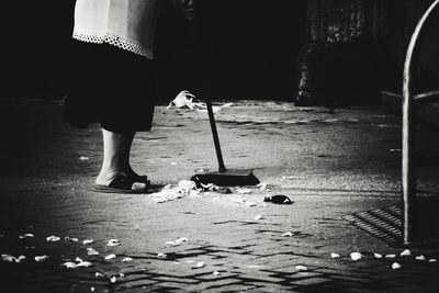 Rear view of woman standing on street